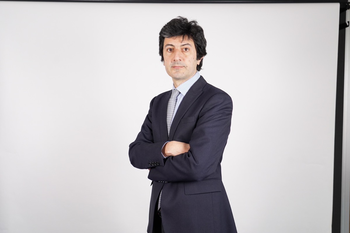 Nicola Borri standing in a suit